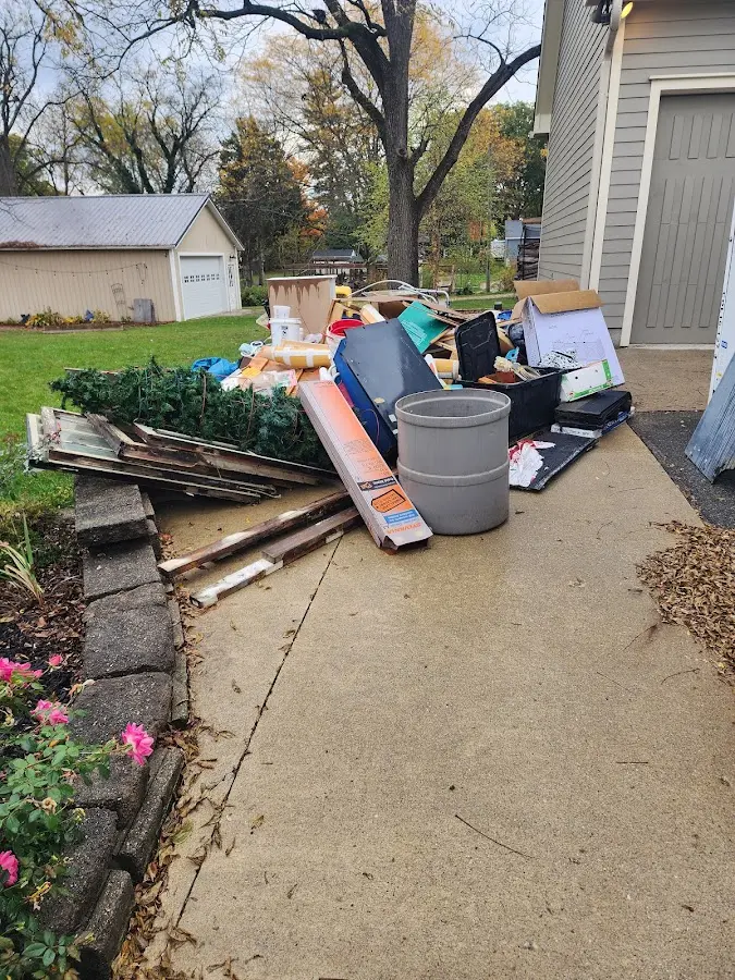 Dumpster being loaded with debris for 30 Yard Dumpster Rental in Tracyton